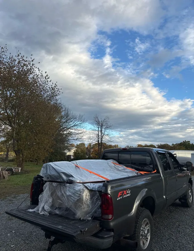 Tarped and strapped load ready to roll on a fall cleanout job